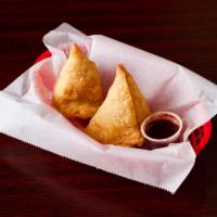 103. Chicken Samosa · 2 pieces. Crispy pastry turnover filled with grounded chicken.