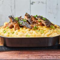 BBQ Pulled Pork Mac · Topped with curry cornbread crumble and scallions. Contains gluten, dairy, soy, shellfish, e...