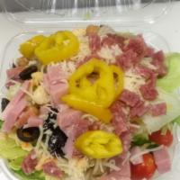 Chopped Italian Salad · Antipasto. Fresh mixed greens, tomatoes, chick peas, salami, ham, black olives, banana peppe...