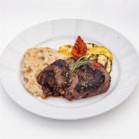 Flame Grilled Sirloin Steak · 10 oz. choice sirloin steak, mashed potatoes, fuego sauteed vegetables, topped with rosemary...