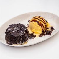 Chocolate Lava Cake · Molten chocolate cake, vanilla ice cream, chocolate drizzle.