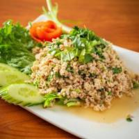 153. Larb Chicken Salad · Ground chicken, cilantro, green onion, dry rice paste, fresh chili tossed in spicy lime dres...