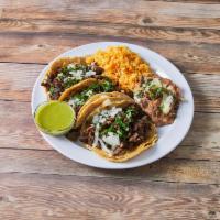 Steak Taco Dinner · Three tacos with rice and beans.