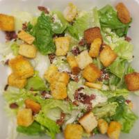 Caesar Salad · Romaine, iceberg lettuce blend with croutons, bacon and Parmesan cheese.