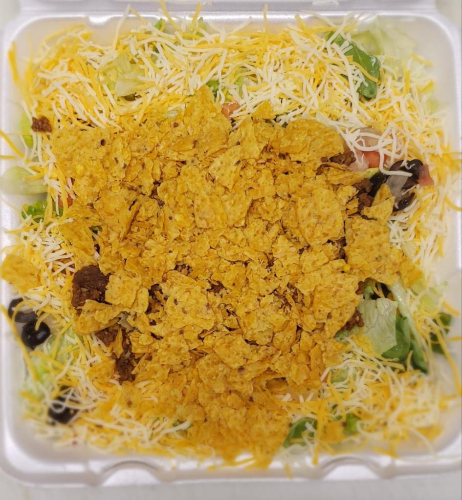 Taco Salad · Romaine, iceberg lettuce blend with tomato, onion, black olives, taco meat, salsa, sour cream, tortilla chips and cheddar Monterey Jack cheese.