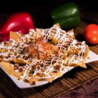 Nachos · Nachos with refried beans, melted cheese, pico de gallo, and sour cream on top. Chips (totop...
