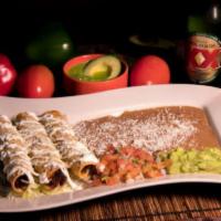 Flauta · 3 tortillas rolled and fried, stuffed with chicken or steak. Covered with sour cream and gra...