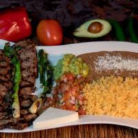 Carne Asada · Steak served with rice, beans, pico de gallo, guacamole, and green onions. Acompanada con ar...