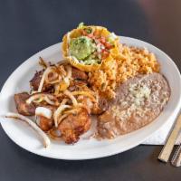 Las Carnitas · Seasoned pork chunks with grilled onions and chile toreado. Served with rice, beans, lettuce...