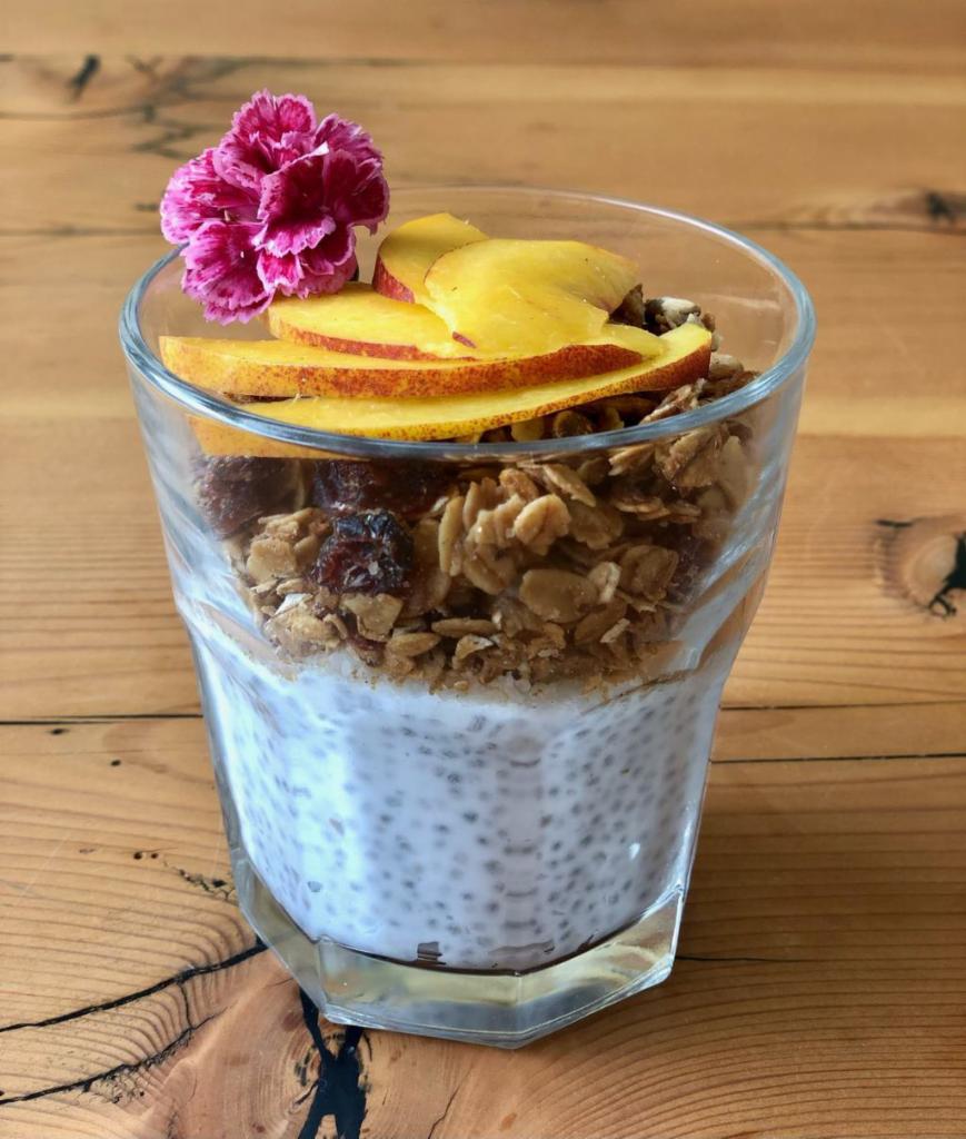 Bree's Chia Seed Pudding · Chia seed pudding made with coconut milk, shaved coconut and house made granola with organic raisins. 