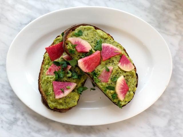 Petit Cafe Avocado Toast with Optional Add Ons · Toasted French Sourdough Batard topped with avocado and marinated radishes