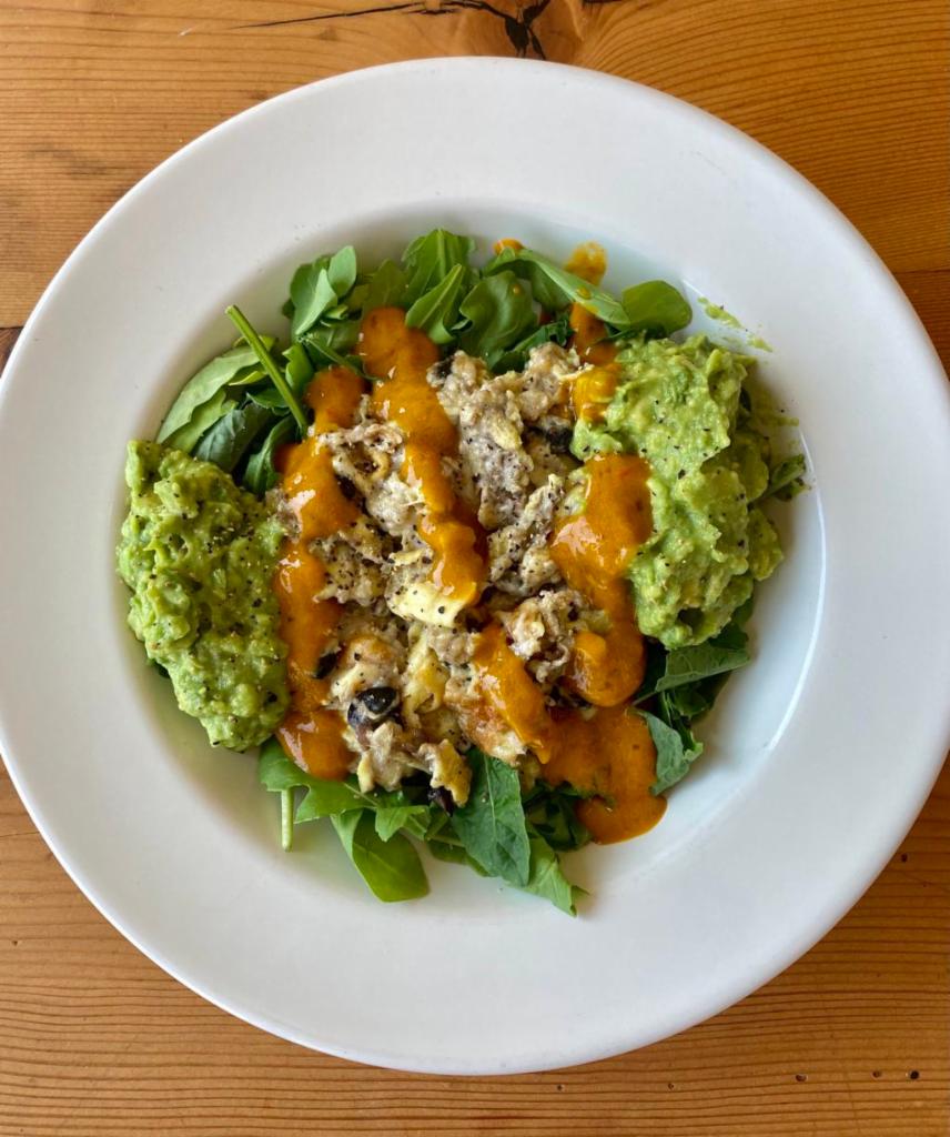 Breakfast Bowl · Eggs scrambled with black beans and cheese, served with two scoops of our avocado mash on a bed of greens with a side of peppadew salsa.