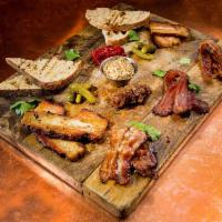 Bacon Board · 5 types of rotating bacon, sweet onion jam, red pepper jam, whole grain, mustard and gherkins.
