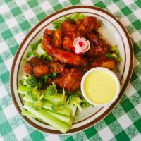 Classic Chicken Wings · 8 pieces of fresh, never frozen jumbo chicken wings served with dressing and fresh celery.
