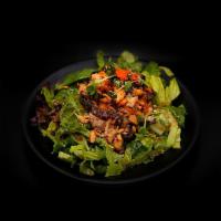 Salmon Skin Salad · Salmon skin, masago, spring mix veggies, special dressing.