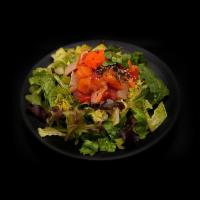 Sashimi Salad · Salmon, tuna, white fish, masago, spring mix salad, special dressing, black sesame seeds.