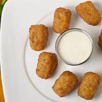Jalapeno Poppers · Breaded and battered chili pepper and cheese bites. Comes with your choice of sauce.
