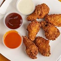 Chicken Wings · Breaded and fried spicy wings. Comes with your choice of sauce on the side.