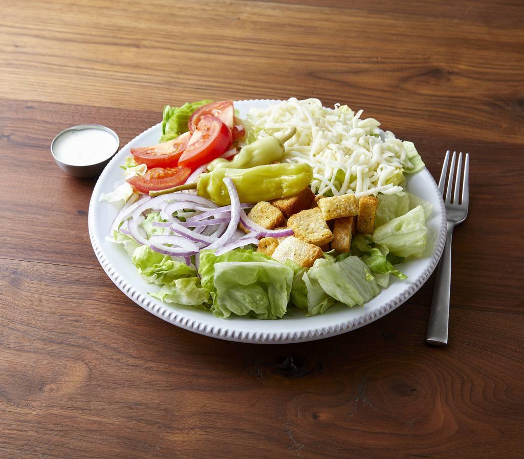 Tossed Salad · Fresh crisp lettuce, topped with tomatoes, red onions, pepperoncini peppers, cheese and croutons.