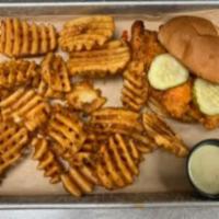 TW'S Hot Chicken Sandwich · Nashville-style hot chicken sandwich with a Tex-Mex twist.  Topped with pickles and served w...