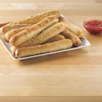 Garlic Parmesan Breadsticks · Oven-baked dough topped with special garlic sauce and Parmesan Italian seasoning. Served wit...