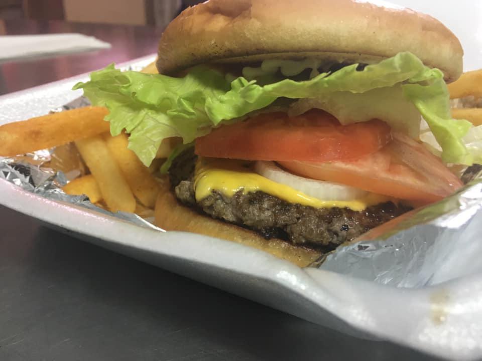 Big Boy Burger · A succulent ground beef patty, seasoned to perfection, topped with crispy lettuce, ripe tomatoes, pickles, and robust onions, all on a toasted bun, just like mama used to make it.