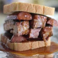 The Big Rink  · A whopping four spare ribs, topped with a heaping portion of smoke sausage and optional cole...