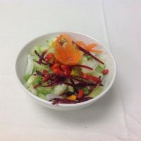 21. Cucumber Salad · Fresh sliced cucumber with sweet and sour vinaigrette dressing, topped with onion, sweet pep...