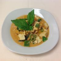 57. Panang Curry · Choice of a meat with green curry, sauce, coconut milk, peanut butter, hot pepper, bell pepp...