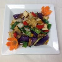 42. Basil Eggplant · Stir fried eggplant with chopped chili, garlic, basil, scallion, bell peppers, onions and ho...