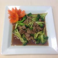 43. Beef Broccoli · Stir fried beef with broccoli and ginger. Served with steamed jasmine rice.