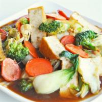 Asian Delight · Sauteed crispy tofu, broccoli, carrots, cabbage, napa cabbage, bok choy, fresh onions in our...