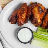 Kickin Chicken Wings · 8 crispy, fried wings with your choice of sauce.