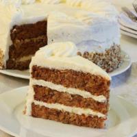 Carrot Cake · Three-layer Carrot Cake topped with Cream Cheese Icing and garnished with chopped Pecans.
*c...