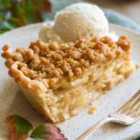 Crumbly Apple Pie a La Mode · Classic Apple Pie sprinkled with Crumb topping served warm with Vanilla Ice Cream and Carame...