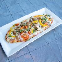 Meat Lovers Flatbread · A Meat lovers dream! Flatbread with Pizza Sauce loaded with Pepperoni, Salami, Sausage, Cana...