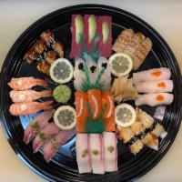 A Sushi and Roll Party Tray · 30 pieces sushi, 2 California, 2 tuna, 2 salmon, 2 shrimp, 1 soft shell crab and 2 dragon. 