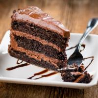 Chocolate Cake · A slice of moist and rich frosted chocolate cake.