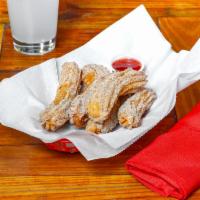 Home Made Churros · Fried pastry dusted with cinnamon sugar.