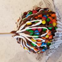 Caramel Apple Featuring M&M’s® · a Granny Smith apple covered in fresh caramel then rolled in M&M candies and topped with mil...
