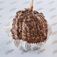 Caramel Apple featuring Snickers® · a Granny Smith apple covered in fresh caramel then covered chopped Snickers candy bars and d...