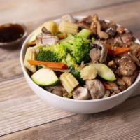 Teriyaki Beef Bowl · Beef wok'd with white onions garnished with broccoli, carrots, baby corn, zucchini and snow ...