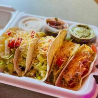 Joco's Tacos · Soft shell white flower tacos with lettuce, tomato, onion, with your choice of chicken or be...