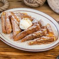 French Toast · Served with whipped butter and premium syrup.