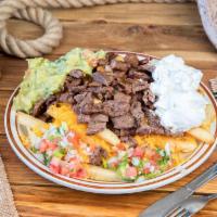 Carne Asada Fries · French fries topped with carne asada, cheese, guacamole, sour cream and homemade pico de gal...