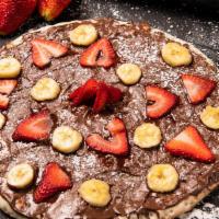 Nutella Pizza · Strawberry Nutella Pizza - A delicious pizza crust topped with strawberries, and Nutella..