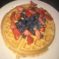 Belgian Waffle Breakfast · A Belgian style waffle served crisp on the outside and light on the inside. Topped off with ...