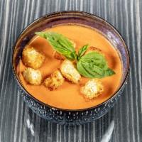 Tomato Bisque Soup · Goat cheese, basil and toast points.