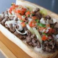 Brazilian Steak Sandwich · Made with French bread, picanha (the center part of top sirloin), grilled onions, mayonnaise...
