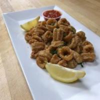 Fried Calamari · Tender calamari lightly floured then fried. Served with marinara sauce and a lemon wedge.